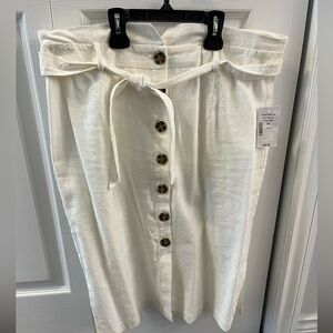 White cotton Cleo skirt, button down front and tie at waist. Tags attached.